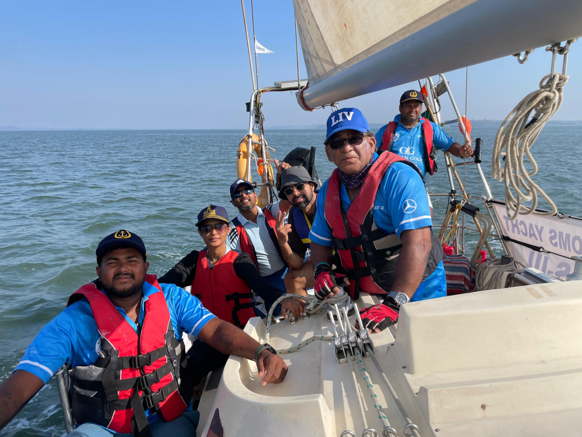 Ocean Gold crew in life jackets aboard a keelboat during the Season I race